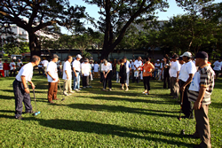 WGU staff teaches how to hit ball.