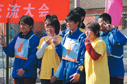 Japanese team that does commemoration taking a picture with BSU students (yellow T-shirt).